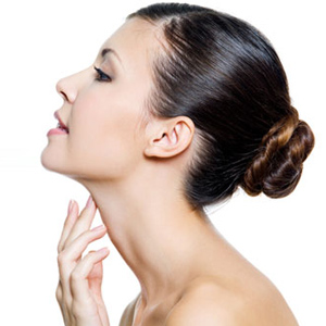 profile view of woman with hand on her neck